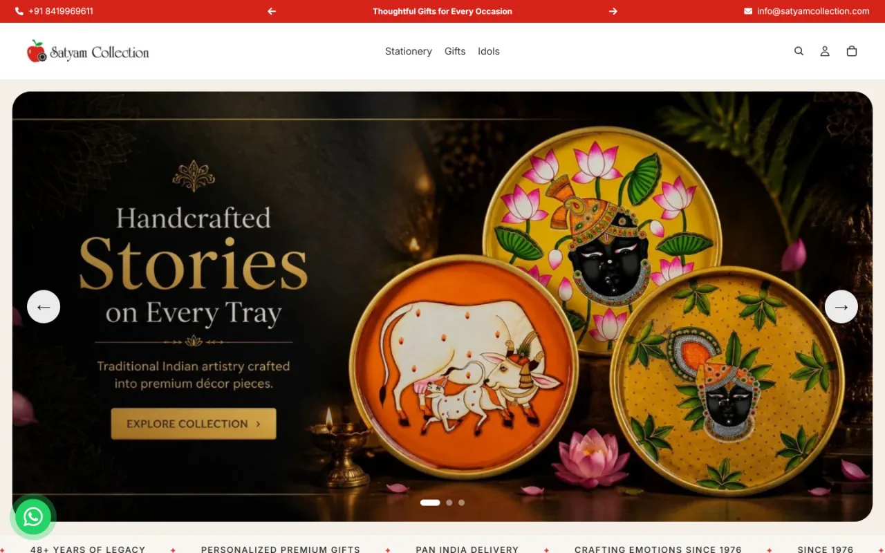 Satyam Collection homepage on a desktop screen: a “Handcrafted Stories on Every Tray” slide of hand-painted decorative trays, below a menu of stationery, gifts and idols.